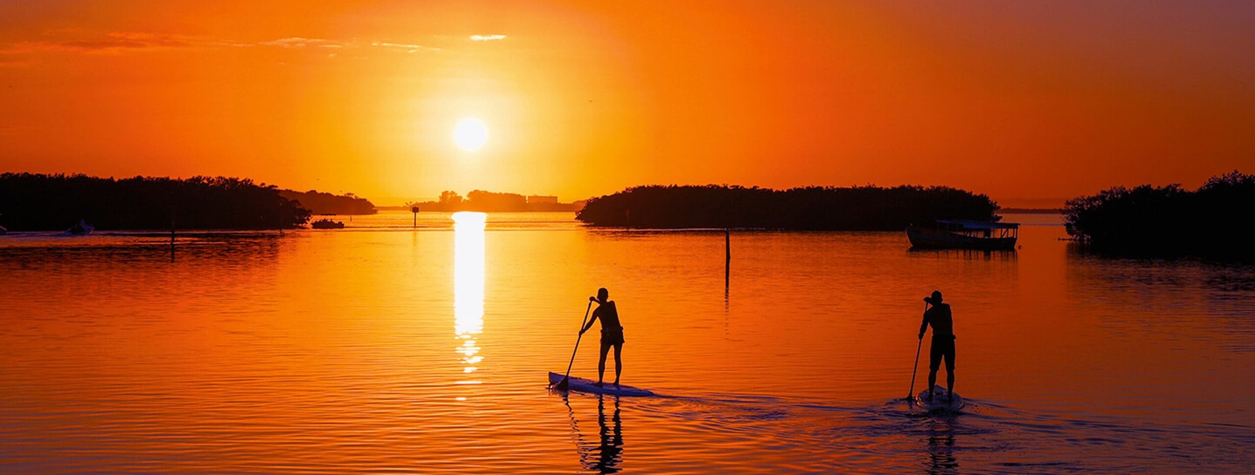 hero-desktop-sunshine-awaits Paddleboarding at sunset