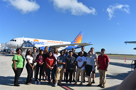 School-visits-PIE-5 Students standing in front of a plane